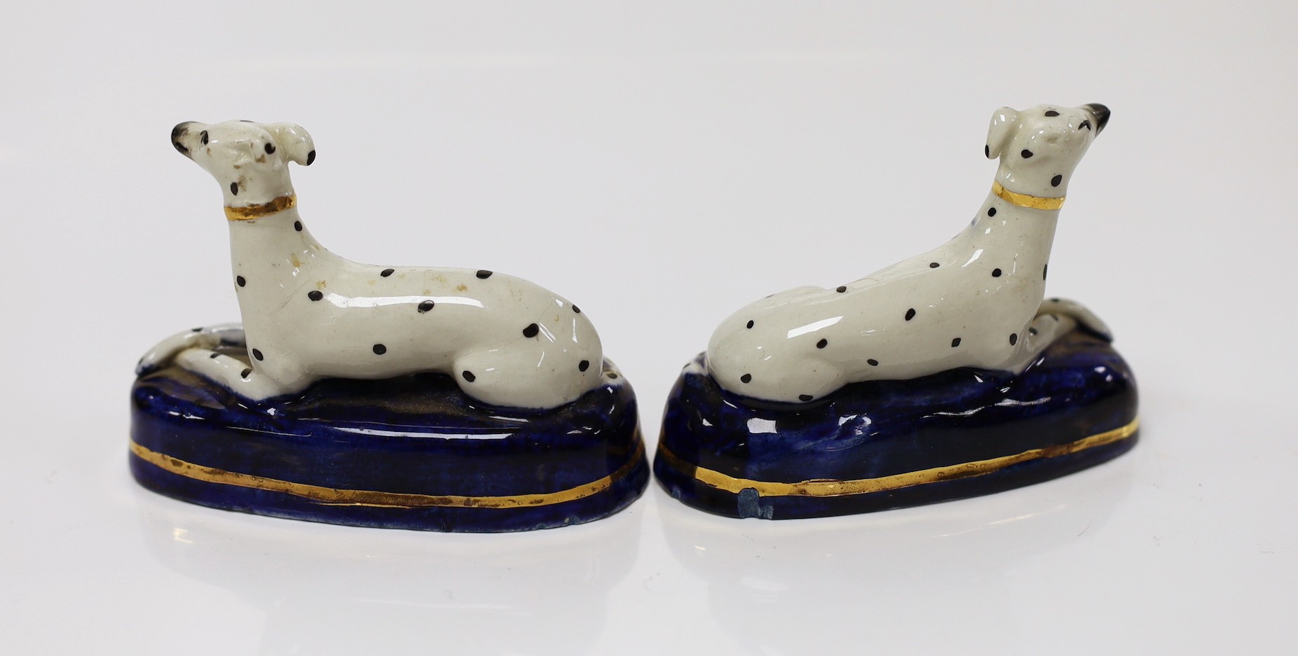 A pair of Staffordshire porcelain dalmations, c.1840, 9.5cms wide